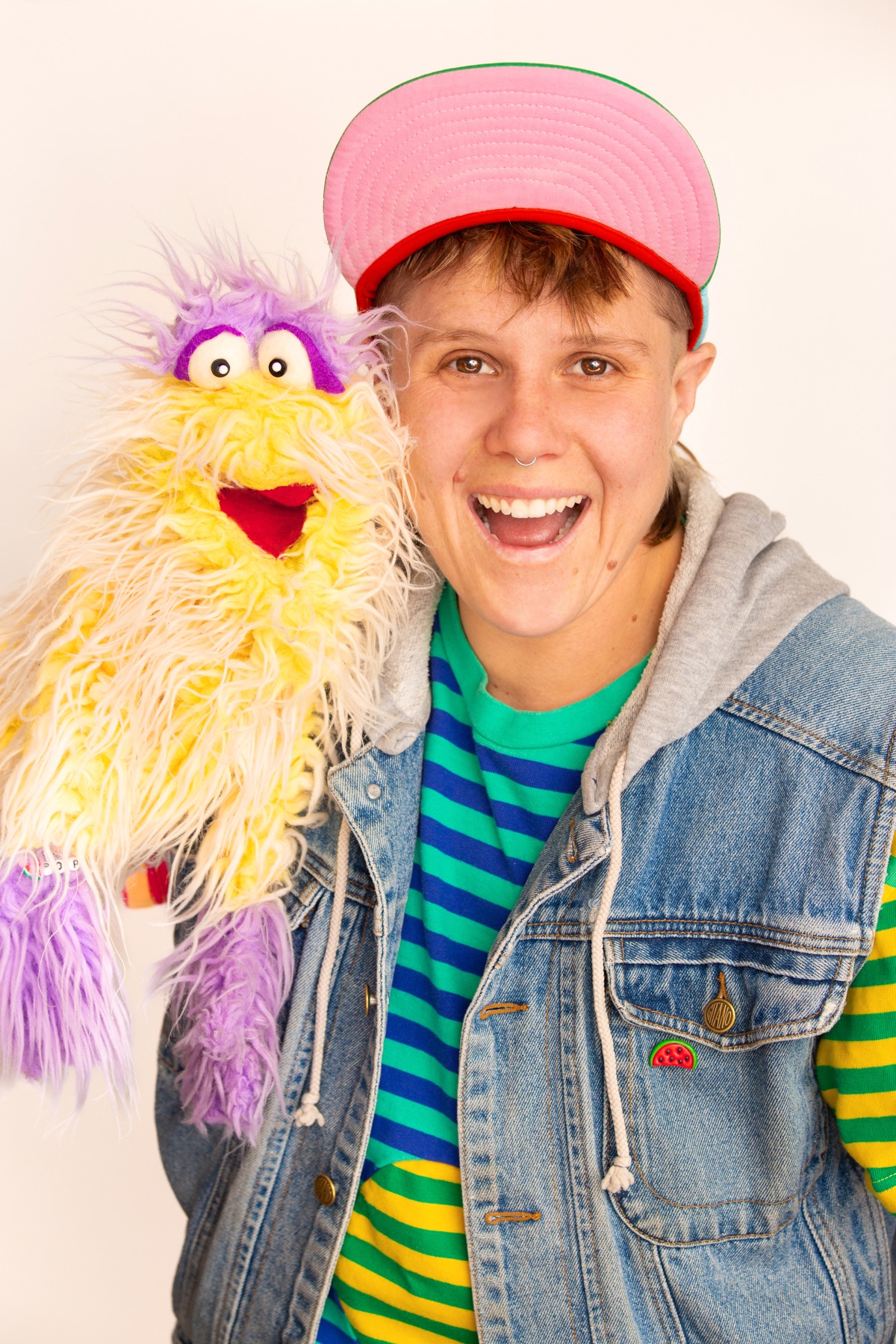 Jules! holding a fluffy yellow puppet